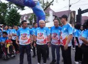 Kajati Sumut Hadiri Acara Yayasan Thongs: Jalan Santai, Santunan Disabilitas, dan Doorprize di Lapangan Benteng Medan